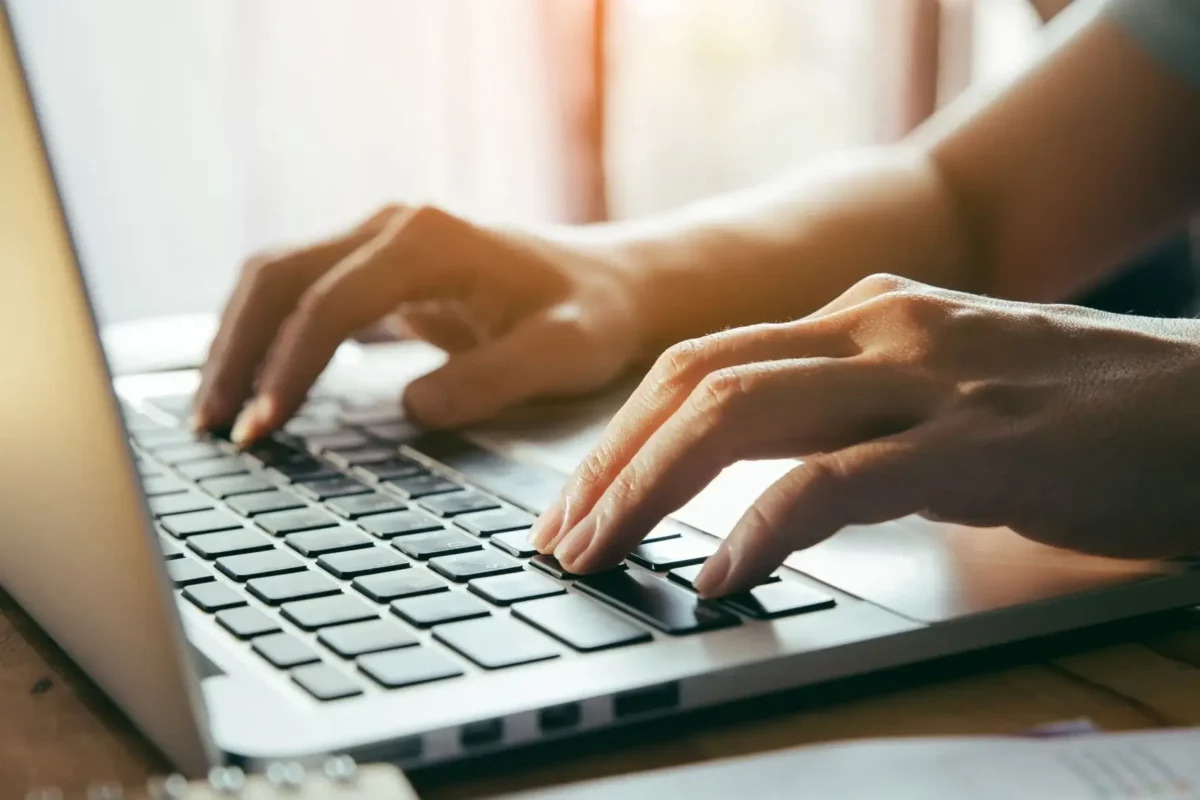 typing on laptop